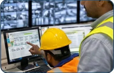 Engineers reviewing industrial control screens
