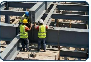 Workers assembling a structural steel frame